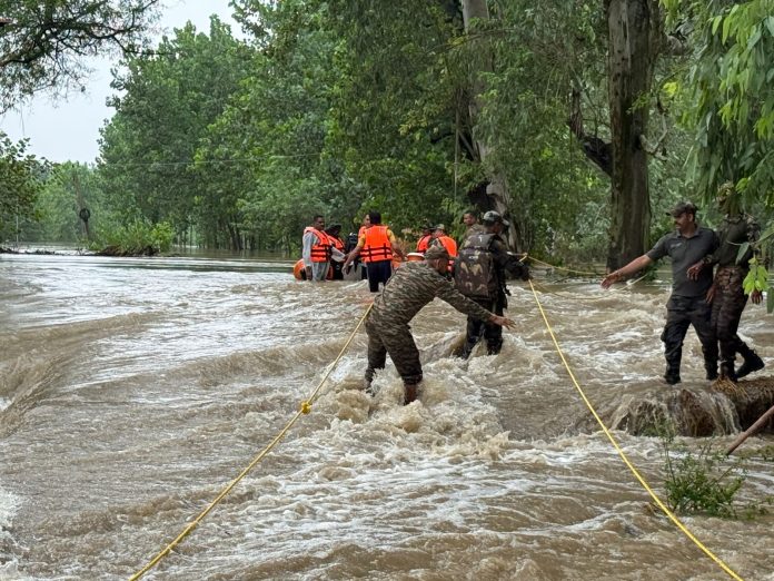 In this disaster, some angels in uniform have landed on the ground to save their loved ones.